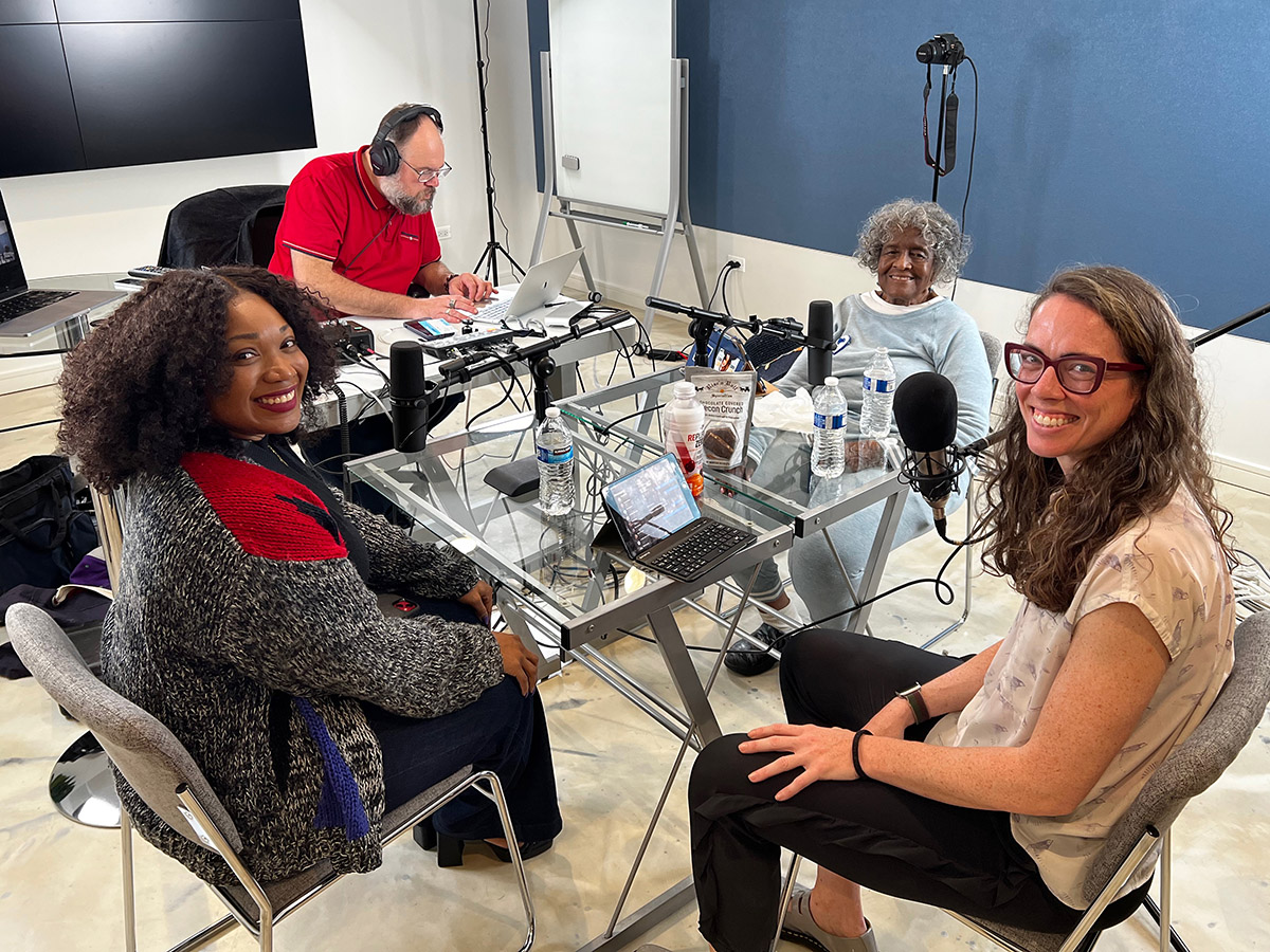 Nina Idemudia and Jackey Grimshaw participate in on a podcast.