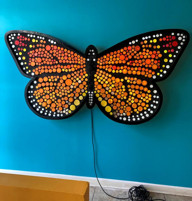 The monarch butterfly and caterpillar mosaic installed in the foyer of LSNA’s building. The butterfly is about 4.5’ tall and 9’ wide, and both mosaics are backlit – making an impressive impression.