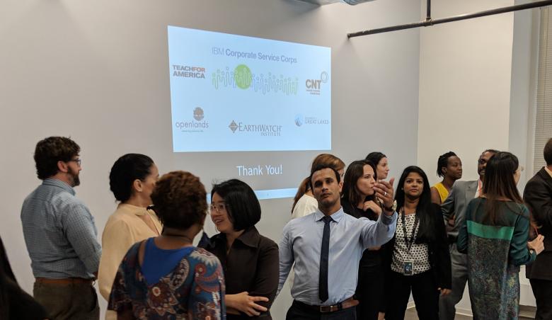 The IBM team invites the photographer to join them for a final group photo (one of approximately 1,000 taken during the assignment).