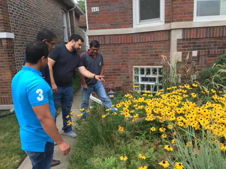 Guided by CNT’s Bryan Nelson, RainReady Field Manager, the IBM consultant team stops to smell the flowers (as they tour a RainReady site).